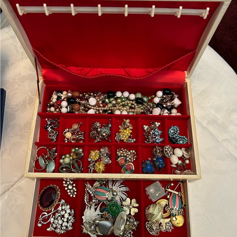 Vintage jewelry box filled with jewelry